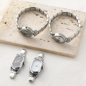 Detailed close-up of stainless steel elastic watch bands and minimalist dial designs