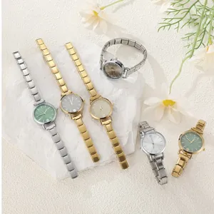 Five assorted stainless steel vintage watches with elastic straps and colorful dials