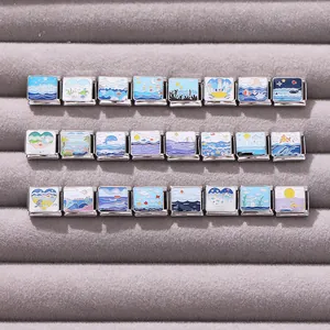 Macro detail of Italian charms collection featuring colorful enamel ocean and sea motifs