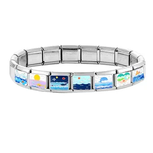 Detail of Italian charm bracelet with colorful ocean wave and whale enamel links