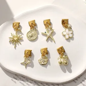 Set aus sieben goldenen Italian Charms mit Sonne, Seestern und Kirsche für DIY-Armbänder