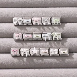 Detail of Italian charm links with colorful pearl bows and starfish on steel base