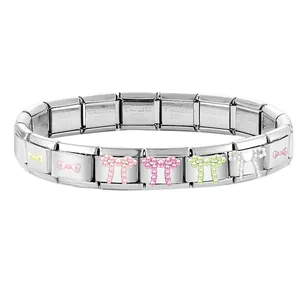 Detailed close-up of stainless steel links with colorful pearl bow charms on a bracelet