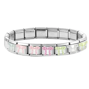Macro shot of stainless steel Italian charm bracelet with colorful pearl butterfly modules