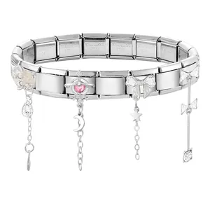 Macro view of Italian charm bracelet links showing stainless steel stamps and rose charms