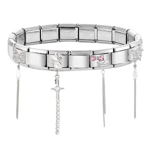 Detailed view of stainless steel charm bracelet with butterfly and cross fringe pendants