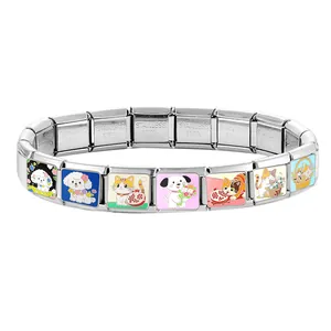 Macro shot of stainless steel modular charms featuring colorful cartoon cat and dog illustrations
