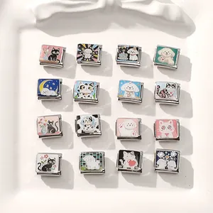 Macro view of modular stainless steel Italian charms with colorful enamel cat and dog designs
