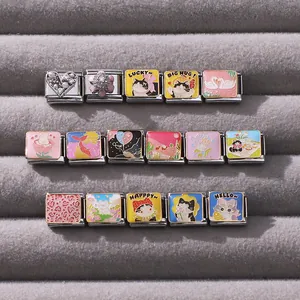 Macro shot of 16 DIY Italian charm links with cute icons in a velvet jewelry box