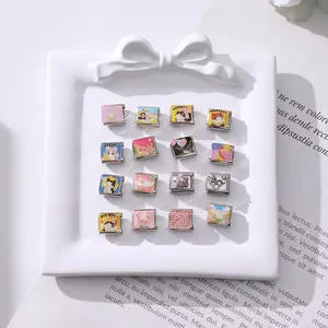 Macro detail of 16-piece Italian charm modules with colorful enamel and crystal designs