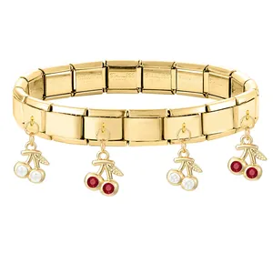 Gold-plated stainless steel modular charm bracelet with detailed cherry fruit pendants