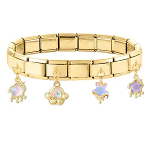 Macro detail of gold modular stainless steel bracelet with iridescent star charms
