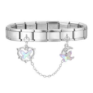 Detail of stainless steel link bracelet featuring butterfly charms and heart moon pendants
