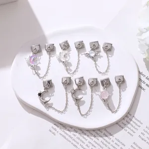 Detaillierte italienische Charm-Links in Silberoptik mit Mond-, Stern- und Rosendesign auf Keramik
