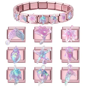 Rose gold stainless steel modular bracelet with ocean charms like starfish and mermaid tails