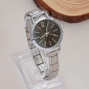 Detail view of the stainless steel engraving on the silver women quartz watch strap