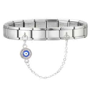 Macro shot of stainless steel Italian link bracelet with a sparkling evil eye charm