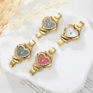Detail view of heart-shaped watches with flexible metal straps in four elegant colors