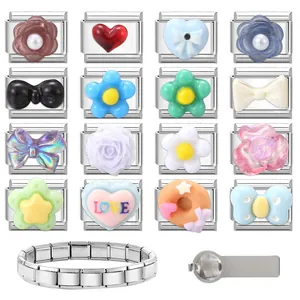 Macro detail of Italian charm bracelet links featuring colorful resin heart and star patterns