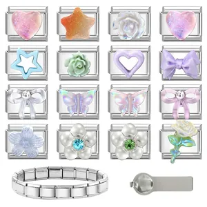 Detailed macro view of 16 modular stainless steel charms with heart and floral patterns