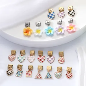 Close-up of colorful enamel charms for Italian modular bracelets with spring clasps