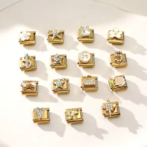Detailed macro shot of diverse gold Italian Charms with rhinestones and pearls