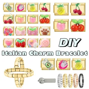 Detail of DIY Italian charm bracelet set with colorful fruit resin pendants on gold bases