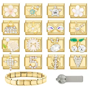 Macro shot of 16 gold Italian charms with diverse patterns and a stainless steel tool