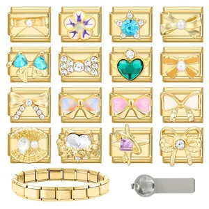 Macro detail of modular Italian charm links in gold stainless steel with colorful inlay