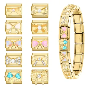 Golden stainless steel modular charm links with butterfly motifs and sparkling crystals