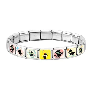 Detail of Italian charm bracelet links featuring cute black cat enamel designs on steel