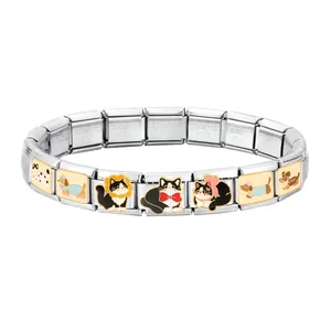 Detailed macro of stainless steel modular charms with cat and dog enamel patterns