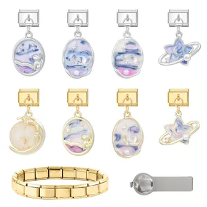Detail of celestial Italian charm links with stainless steel base and opening tool
