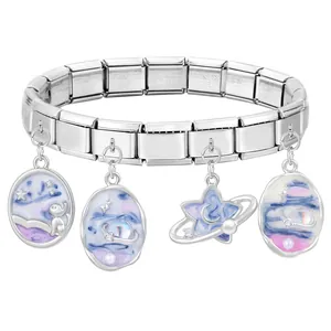 Detail of stainless steel modular bracelet with cosmic cat, moon and nebula enamel charms