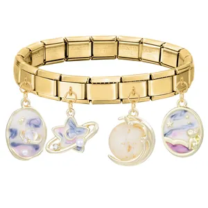 Detail of gold stainless steel modular bracelet with starry night and cat pearl charms