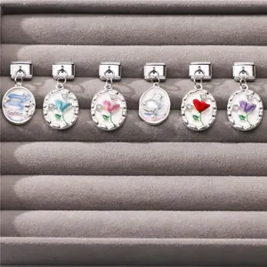 Detail of Italian style enamel flower charms with crystals in a velvet display tray