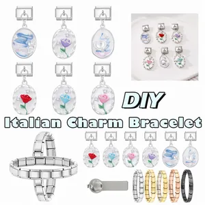 Macro detail of Italian charm bracelet links featuring enamel flowers and stainless steel