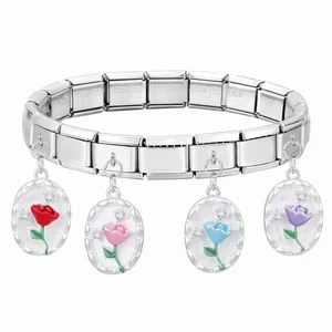 Detail of Italian charm bracelet with modular links and colorful floral oval pendants