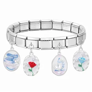 Detailed view of modular stainless steel bracelet with oval enamel floral charms