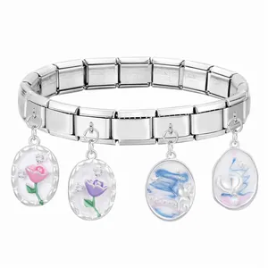 Detail of Italian modular stainless steel bracelet with floral and crescent charms