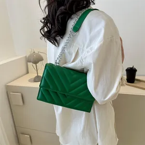Stylish emerald green V-quilted chain shoulder bag for women with silver metal strap