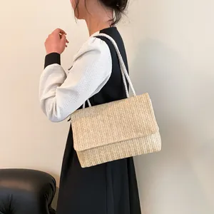 Minimalist straw woven tote bag with cotton rope straps and herringbone pattern