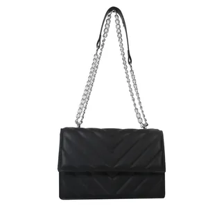 Classic black chevron quilted shoulder bag with adjustable silver chain strap on white background