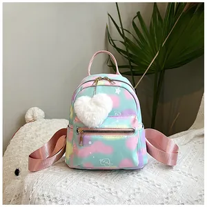 Detail of macaron tie-dye nylon backpack with plush heart charm and gold zippers