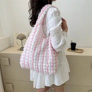 Pink and white striped popcorn textured tote bag with puffy shoulder strap and large capacity