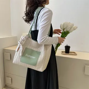 Straw tote bag with green leather patch and Summer lettering including a floral scarf