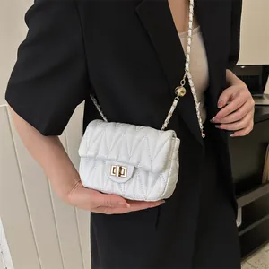Chic white quilted crossbody bag with gold chain strap and wave texture for women