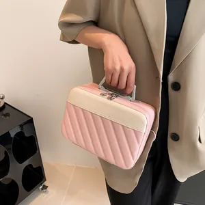 Chic pink and beige quilted square handbag with silver metal handle for daily commute