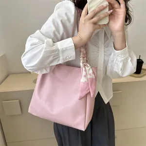 Pink faux leather tote bag with floral scarf handle decoration for casual commute