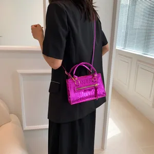 Hot pink hot pink crocodile embossed handbag with metallic finish and top handles